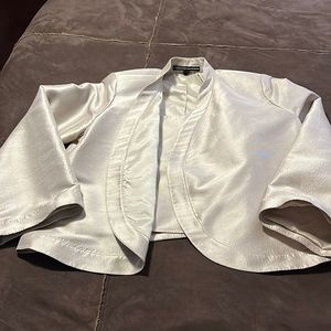 Woman’s Ellen Tracy Jacket size 12 and top size 14, no skirt.